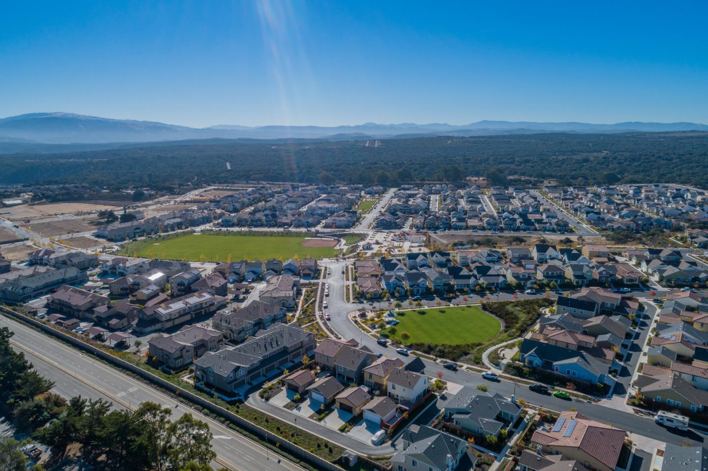 18643 McClellan Circle East Garrison, CA 93933 - Photo 14 of 42 a view of a swimming pool with a lot of trees in the background