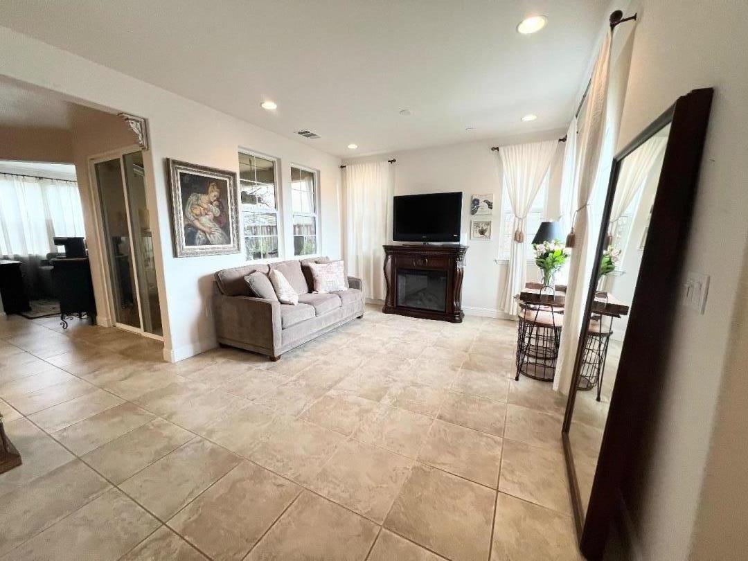 18643 McClellan Circle East Garrison, CA 93933 - Photo 25 of 42 a living room with furniture and a flat screen tv