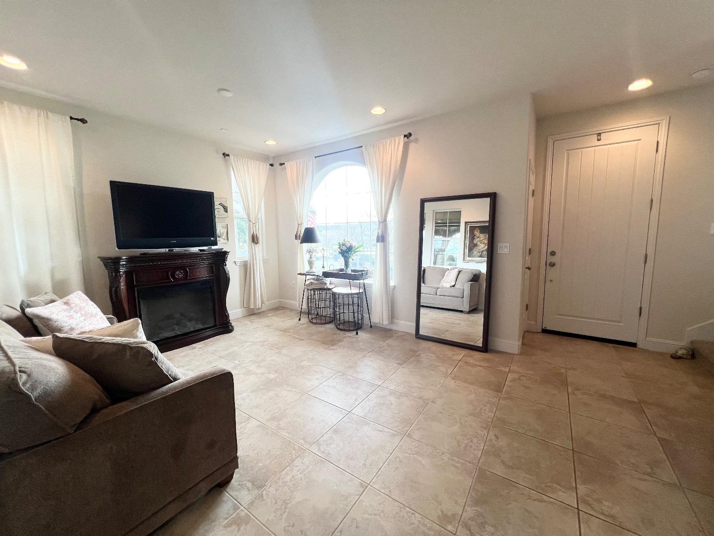 18643 McClellan Circle East Garrison, CA 93933 - Photo 26 of 42 a living room with furniture and a flat screen tv