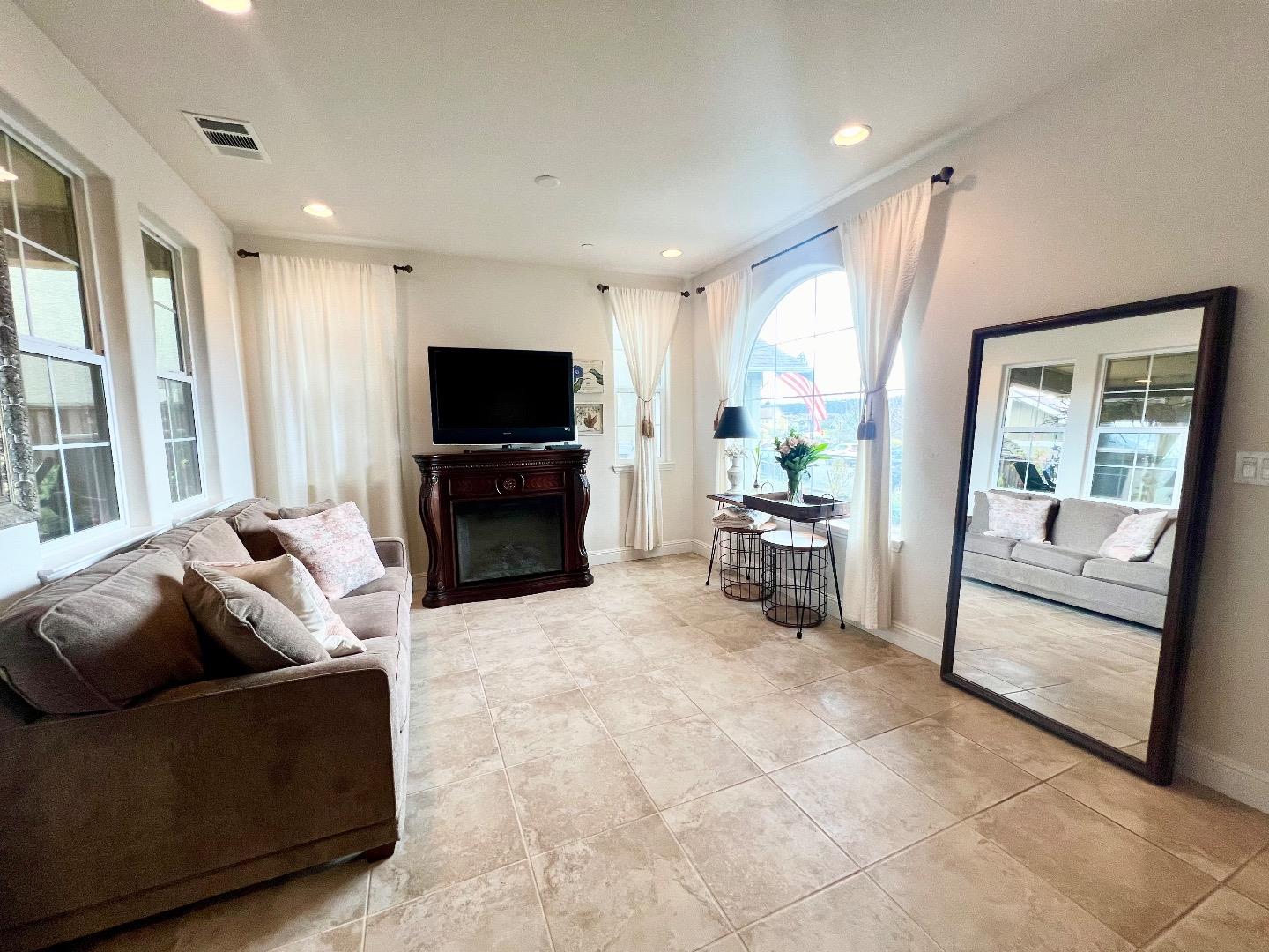 18643 McClellan Circle East Garrison, CA 93933 - Photo 27 of 42 a living room with furniture and a flat screen tv