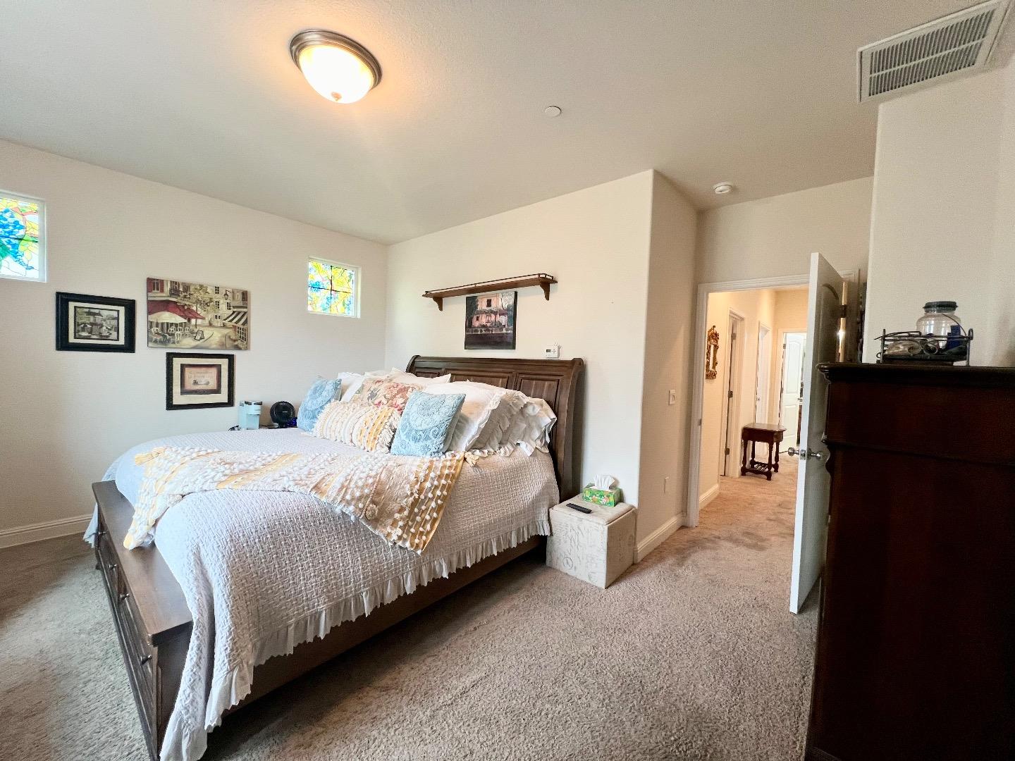 18643 McClellan Circle East Garrison, CA 93933 - Photo 35 of 42 a bedroom with a bed and a painting