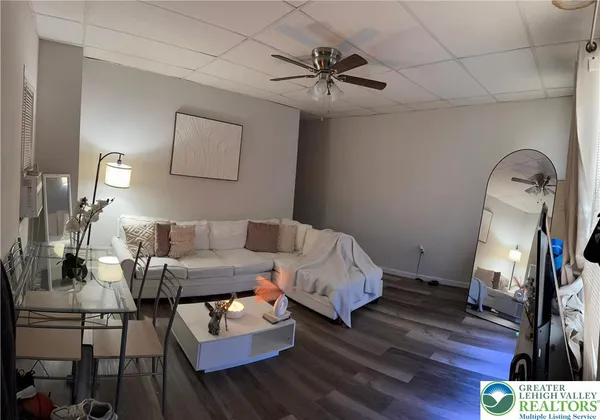 a bathroom with a toilet a sink and a mirror