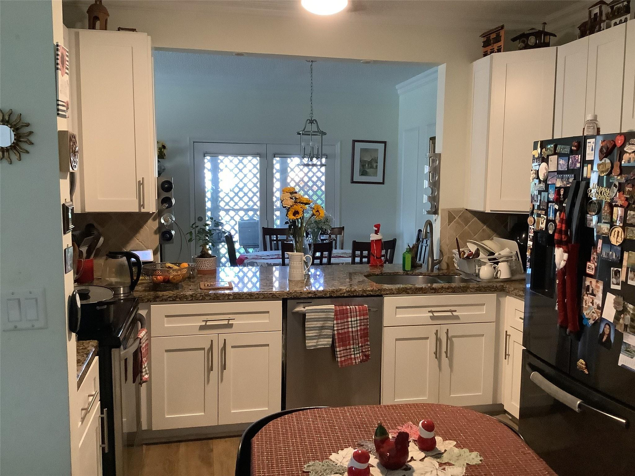 4765 South Hemingway Circle, Unit 68 Margate, FL 33063 - Photo 14 of 39 a kitchen with a sink window and cabinets