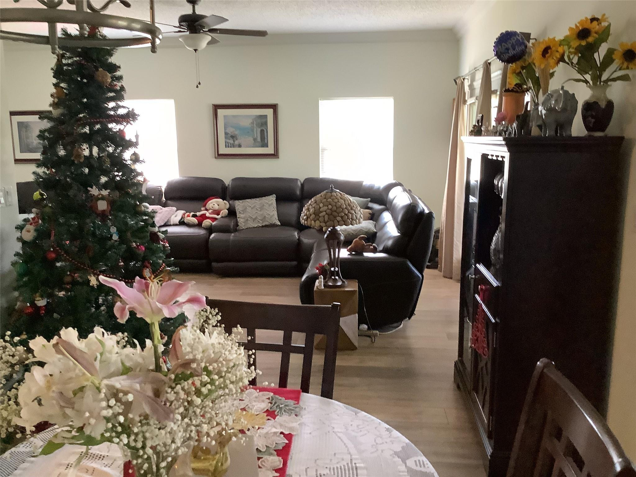 4765 South Hemingway Circle, Unit 68 Margate, FL 33063 - Photo 19 of 39 a living room with furniture and flowers