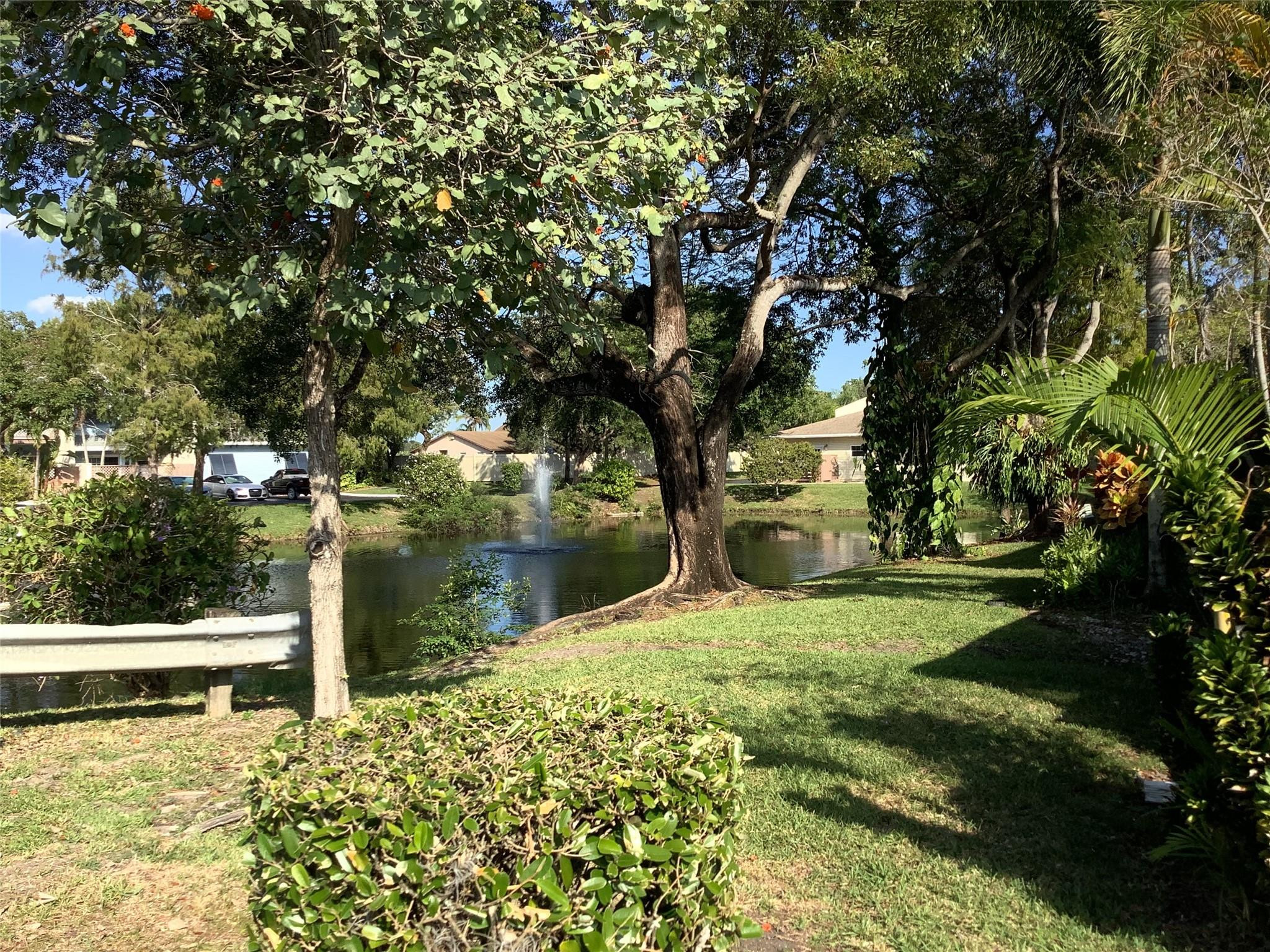 4765 South Hemingway Circle, Unit 68 Margate, FL 33063 - Photo 4 of 39 a backyard of a house with lots of green space