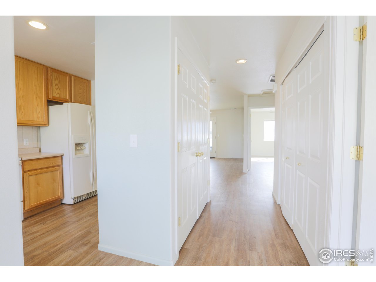 6827 Autumn Ridge Drive, Unit 4 Fort Collins, CO 80525 - Photo 12 of 28 a view of a hallway with wooden floor