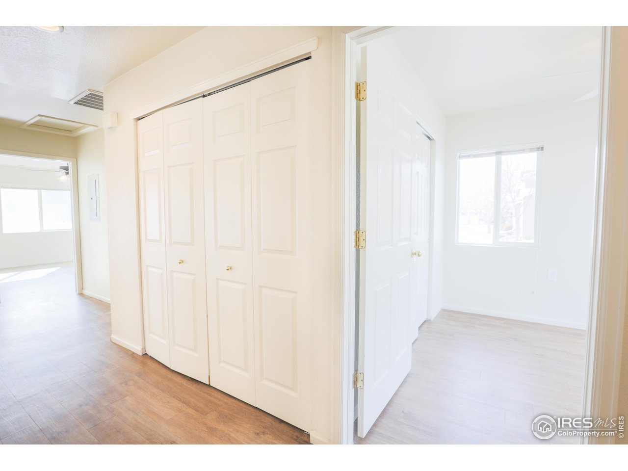 6827 Autumn Ridge Drive, Unit 4 Fort Collins, CO 80525 - Photo 13 of 28 a view of an empty room with wooden floor