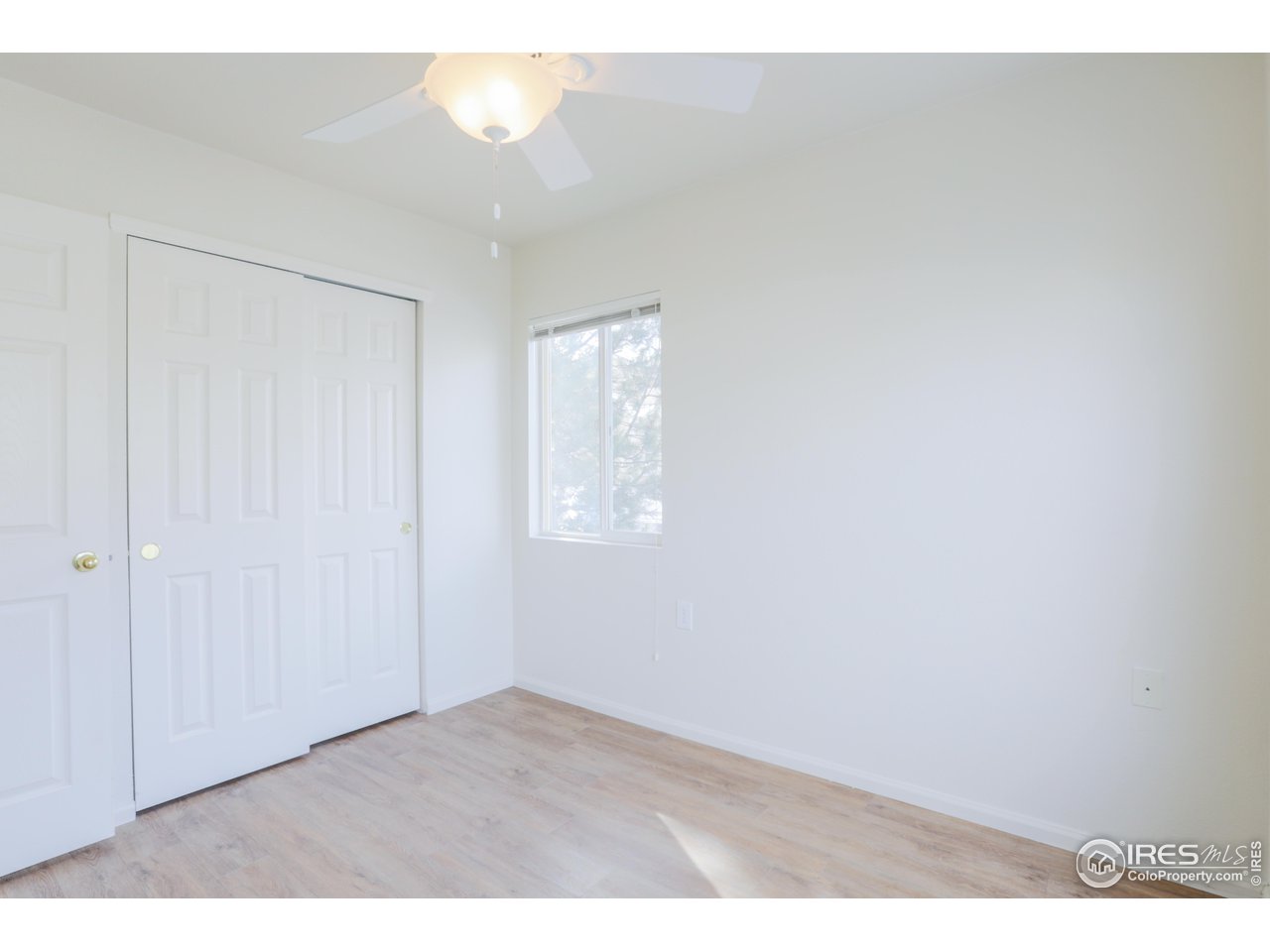 6827 Autumn Ridge Drive, Unit 4 Fort Collins, CO 80525 - Photo 17 of 28 a view of an empty room and window