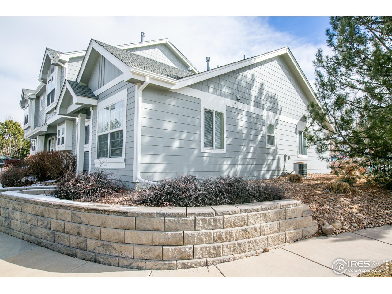 6827 Autumn Ridge Drive, Unit 4 Fort Collins, CO 80525 - Photo 2 of 28 a view of a house with a yard