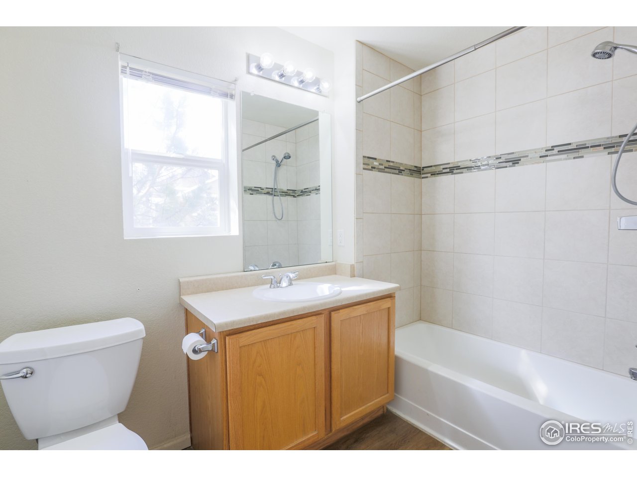6827 Autumn Ridge Drive, Unit 4 Fort Collins, CO 80525 - Photo 21 of 28 a bathroom with a sink a toilet and shower