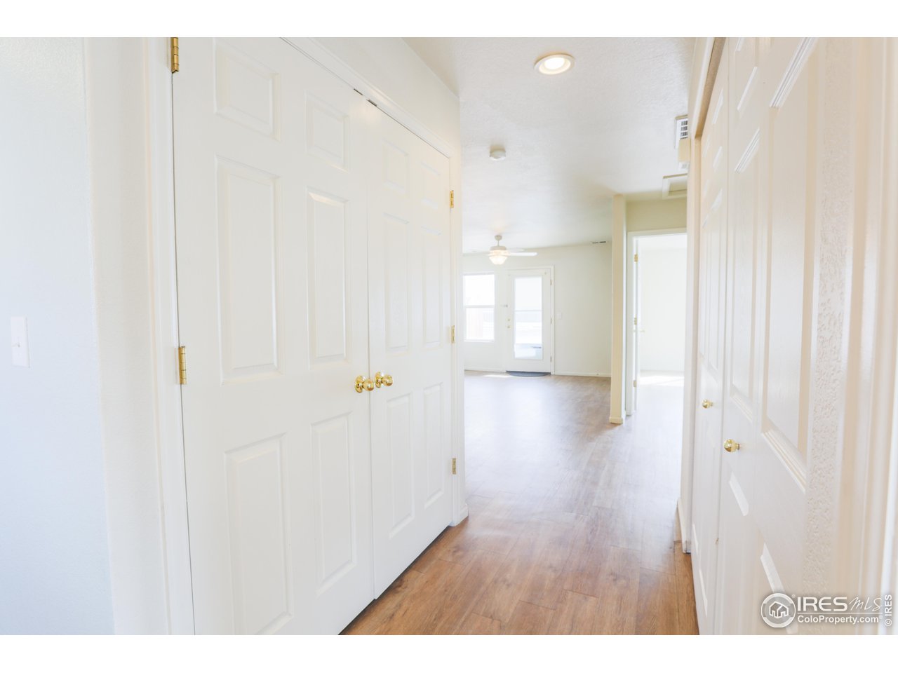6827 Autumn Ridge Drive, Unit 4 Fort Collins, CO 80525 - Photo 24 of 28 a view of a hallway with wooden floor