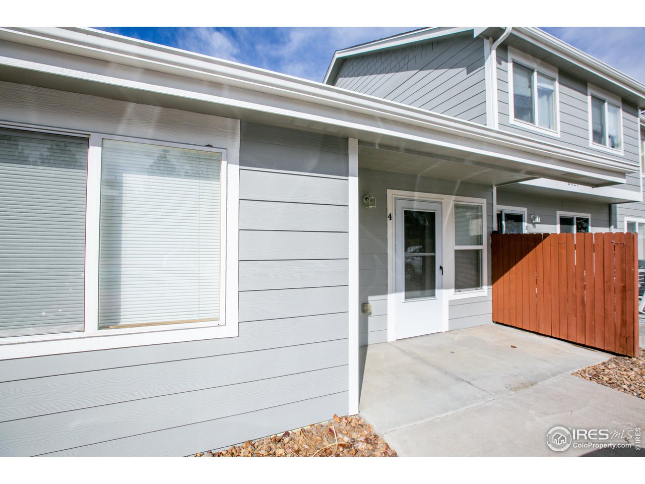 6827 Autumn Ridge Drive, Unit 4 Fort Collins, CO 80525 - Photo 27 of 28 a view of a house with a door