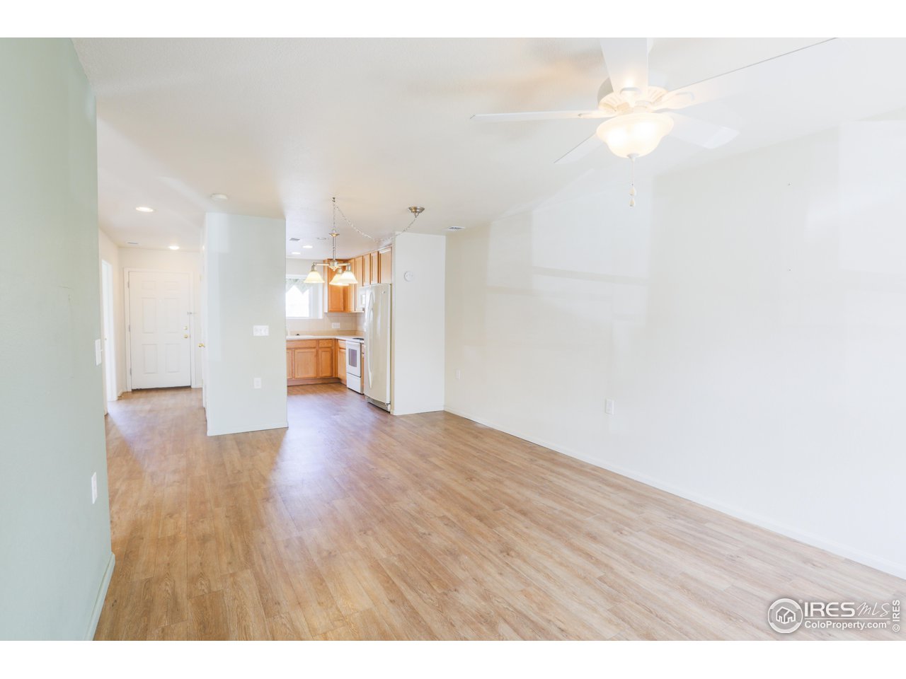 6827 Autumn Ridge Drive, Unit 4 Fort Collins, CO 80525 - Photo 7 of 28 a view of an empty room with wooden floor