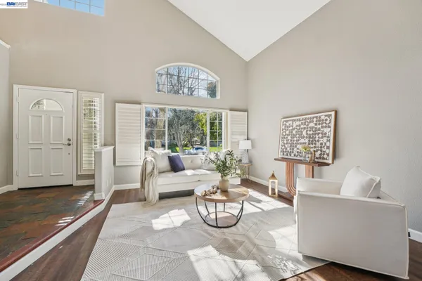a view of patio with a table chairs and a yard