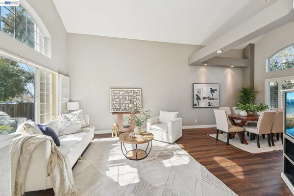 a view of a house with backyard porch and sitting area