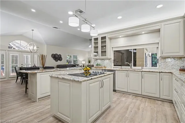 a kitchen with lots of counter top space and a sink
