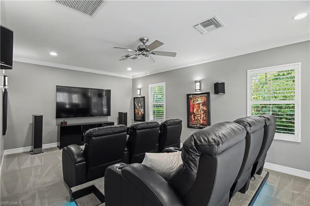 5186 Tallowood Way Naples, FL 34116 - Photo 18 of 50 a living room with furniture and a flat screen tv