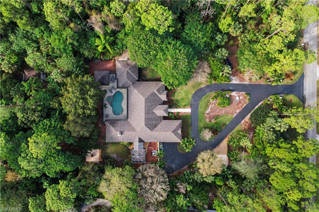 5186 Tallowood Way Naples, FL 34116 - Photo 2 of 50 an aerial view of a house with outdoor space