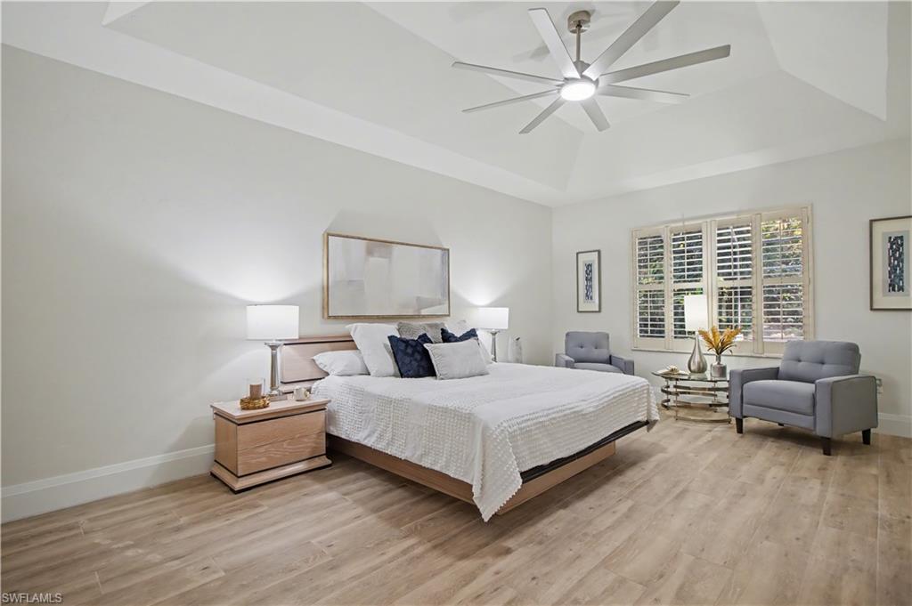 5186 Tallowood Way Naples, FL 34116 - Photo 23 of 50 a bedroom with a bed and a couch