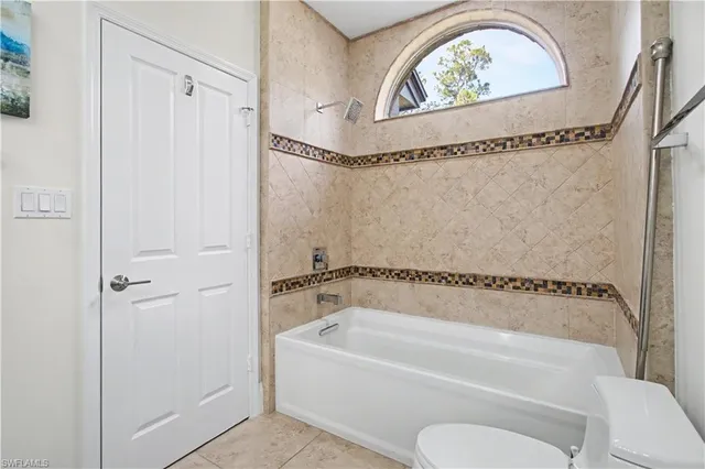a bathroom with a tub and a shower