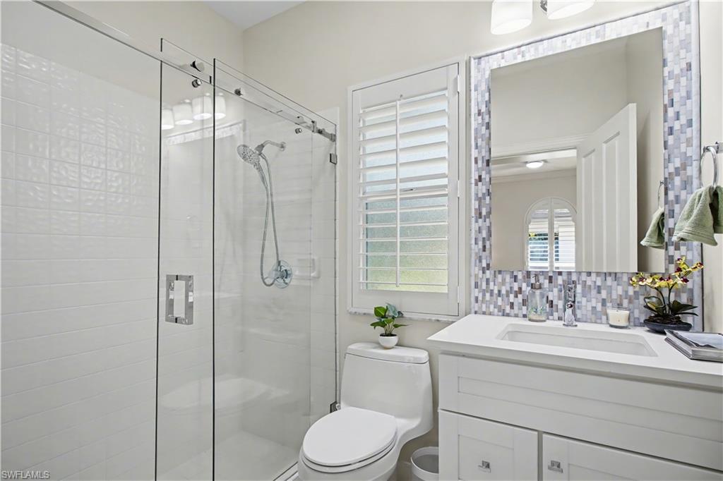 5186 Tallowood Way Naples, FL 34116 - Photo 35 of 50 a bathroom with a sink toilet and shower