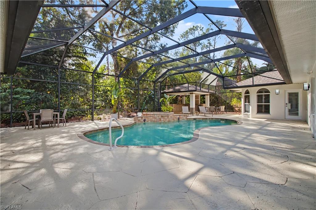 5186 Tallowood Way Naples, FL 34116 - Photo 38 of 50 a view of a house with a backyard