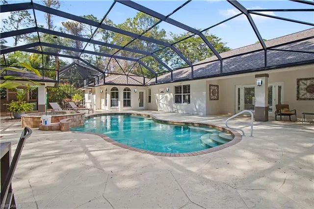 a view of a swimming pool with a patio