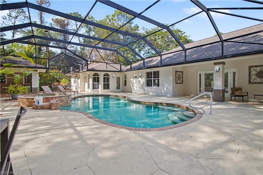 5186 Tallowood Way Naples, FL 34116 - Photo 39 of 50 a view of a swimming pool with a patio