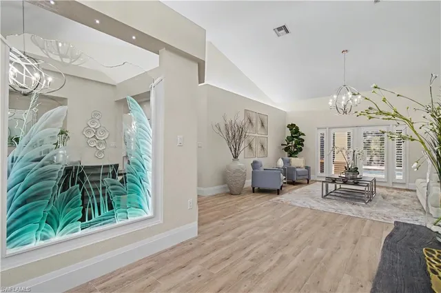 a view of a livingroom with furniture and a potted plant