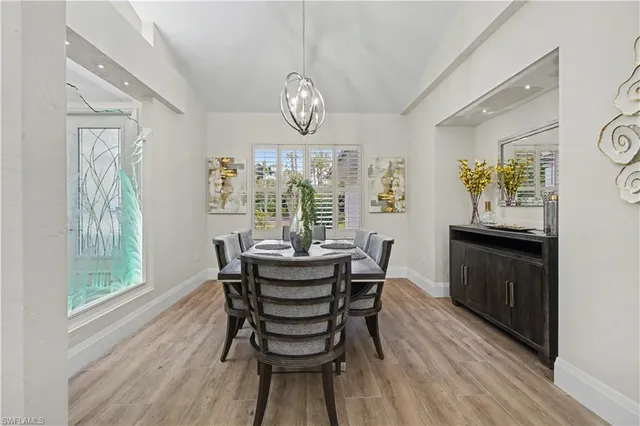 a dining room with furniture and window