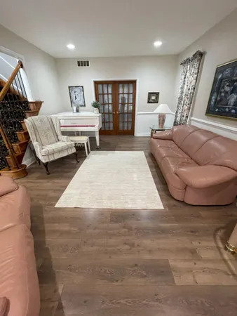 a spacious bedroom with a bed and window