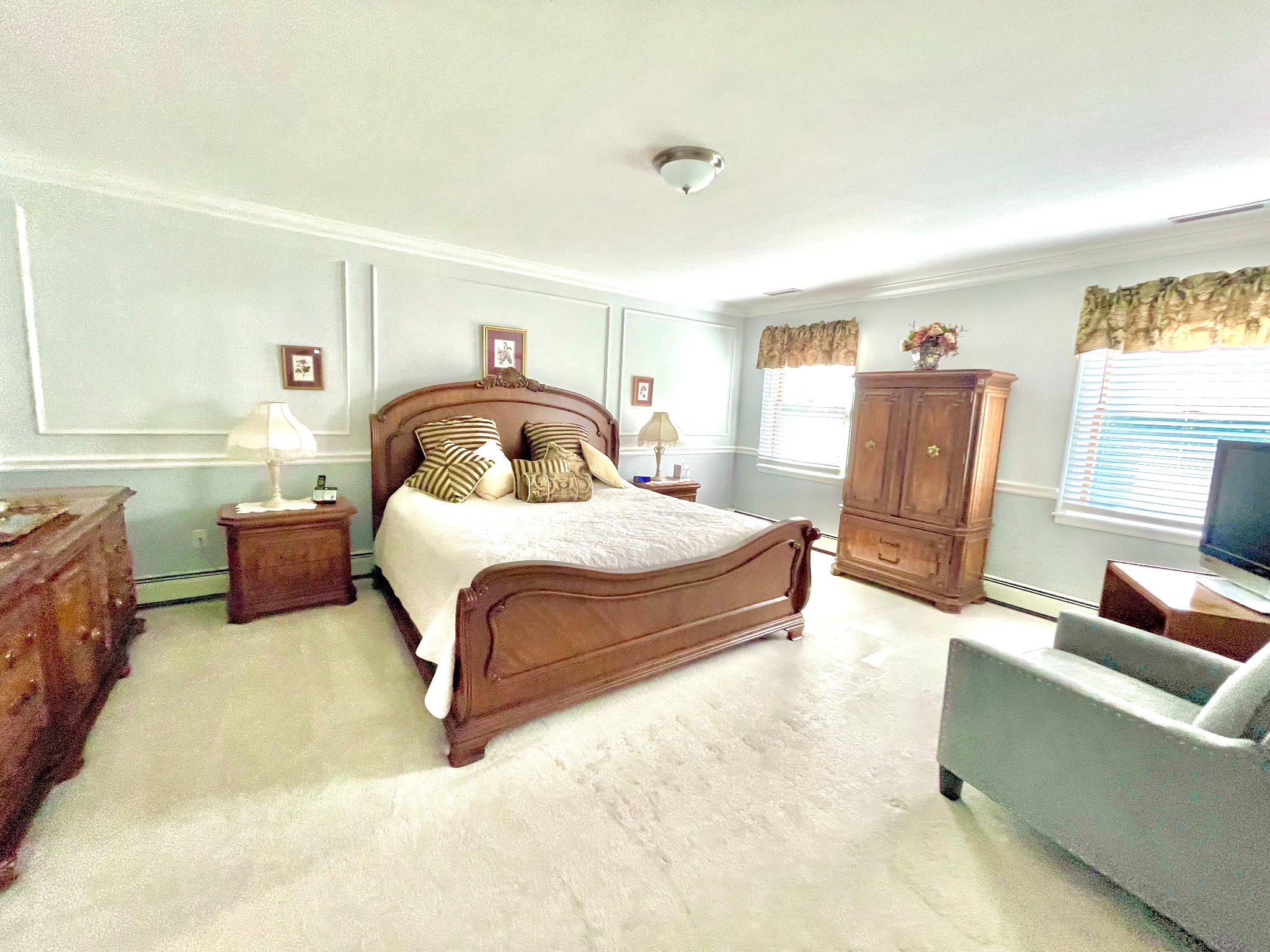 1830 Buck Road Feasterville-Trevose, PA 19053 - Photo 25 of 48 a spacious bedroom with a bed and couch