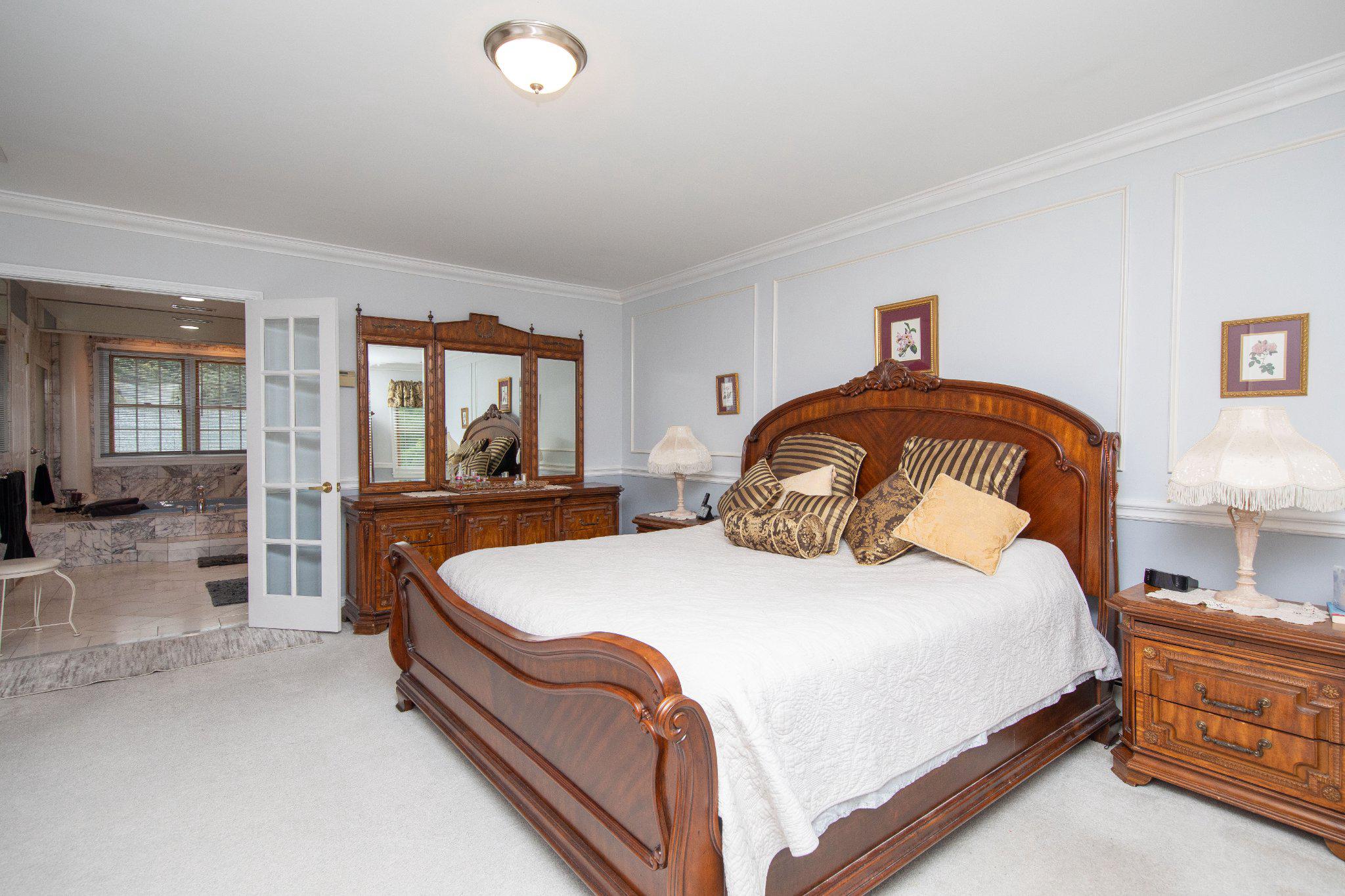1830 Buck Road Feasterville-Trevose, PA 19053 - Photo 26 of 48 a bedroom with a large bed and a large window