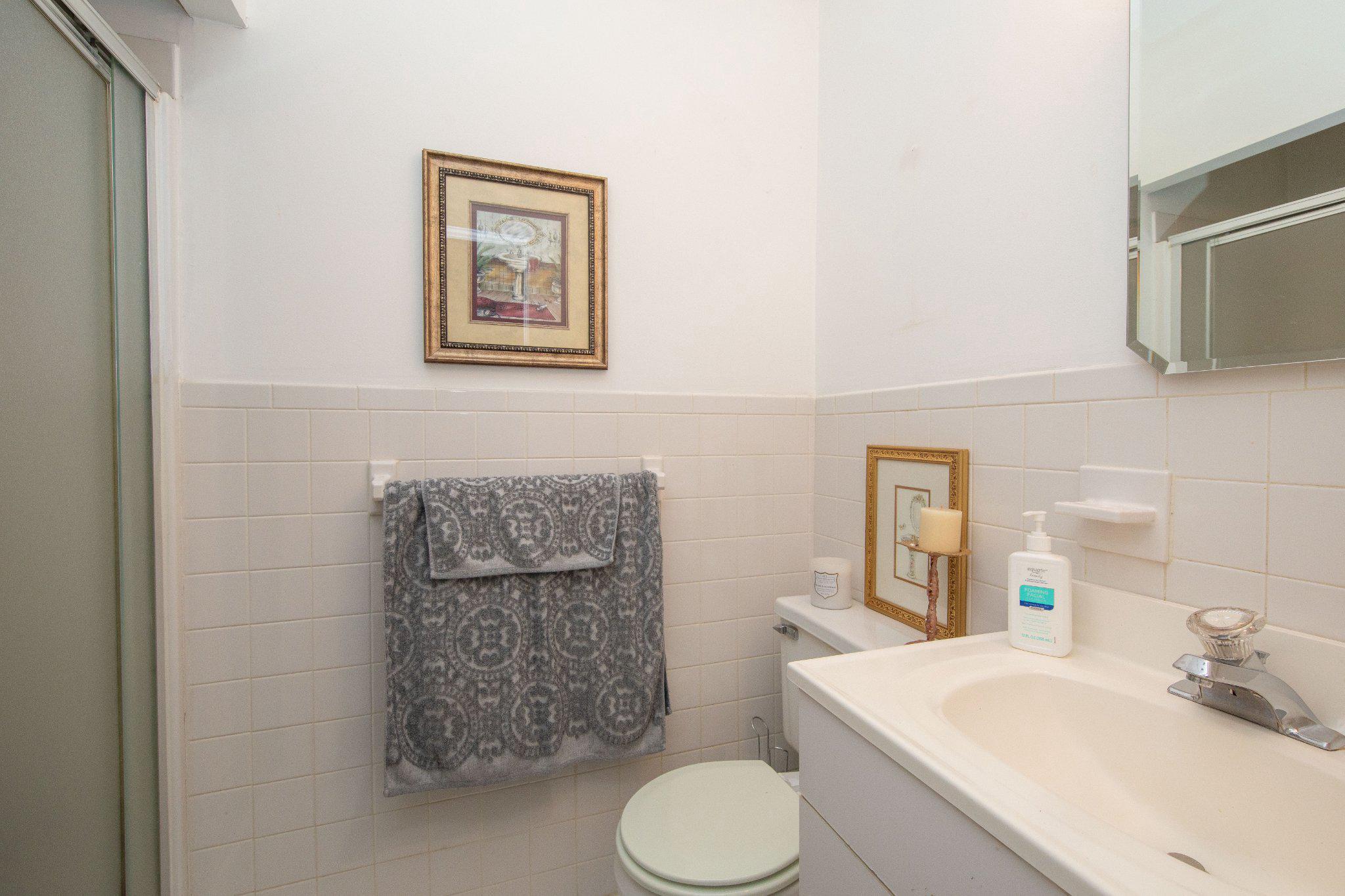 1830 Buck Road Feasterville-Trevose, PA 19053 - Photo 31 of 48 a bathroom with a toilet sink and mirror