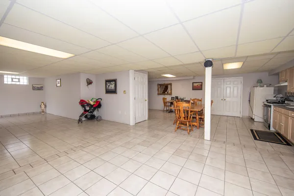 a bedroom with furniture and a gym equipment