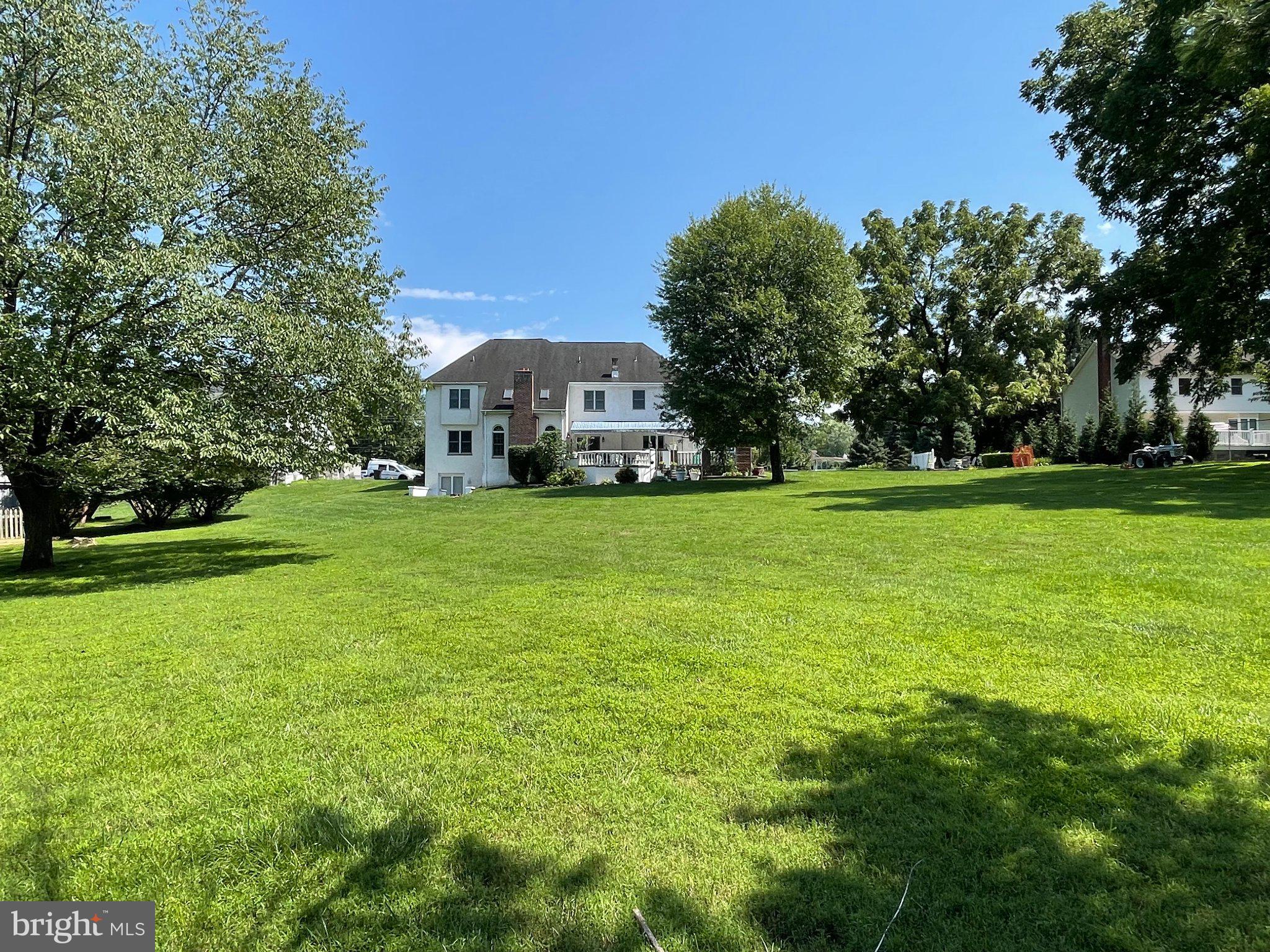 1830 Buck Road Feasterville-Trevose, PA 19053 - Photo 37 of 48 a view of a trees in front of a house with a yard