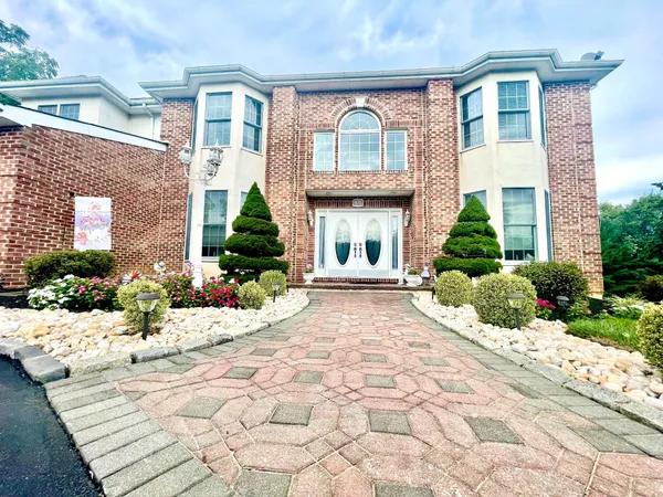 a view of a house with potted plants