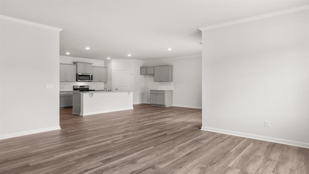 6012 Muirfield Point Union City, GA 30213 - Photo 16 of 37 a view of a kitchen with a sink and a stove top oven