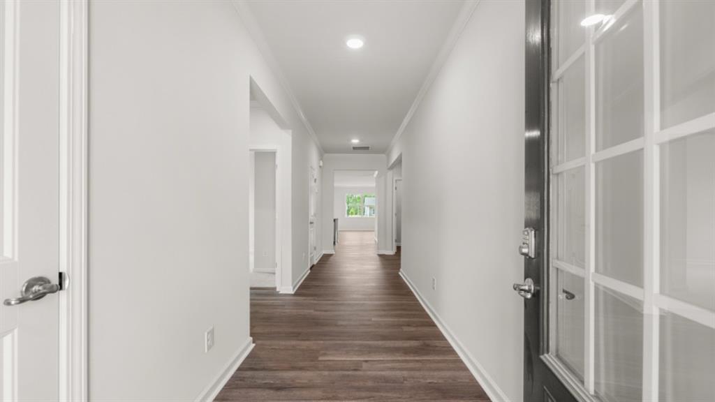 6012 Muirfield Point Union City, GA 30213 - Photo 2 of 37 a view of a hallway with wooden floor