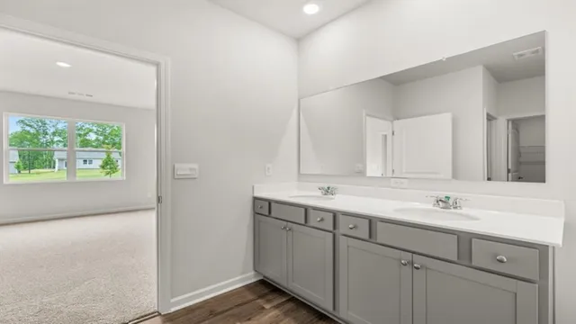 a bathroom with a glass shower door