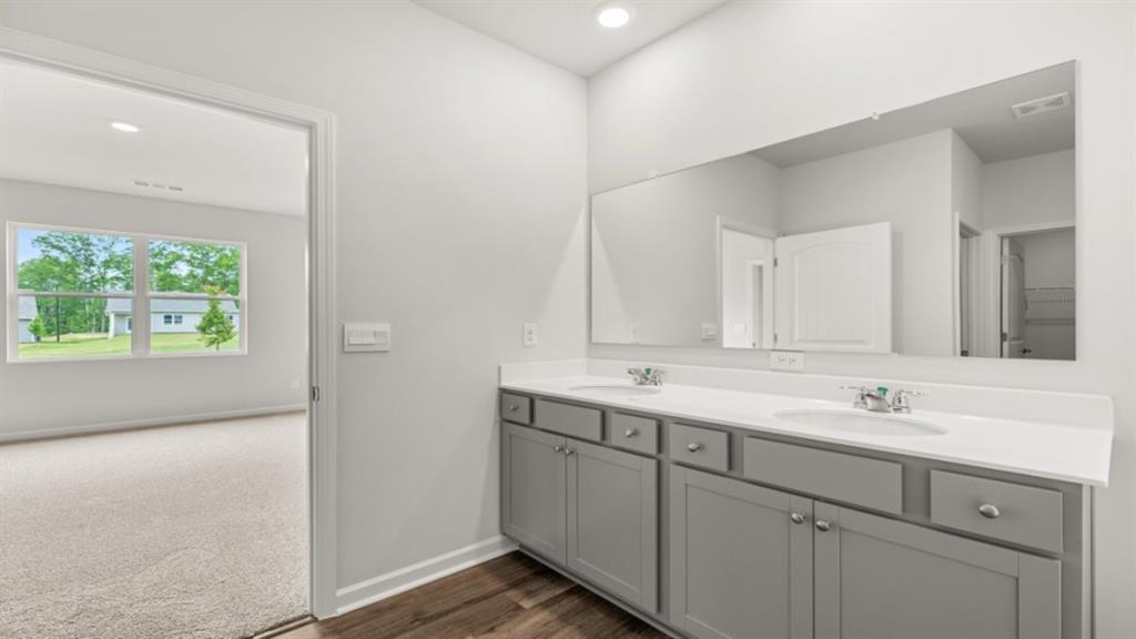 6012 Muirfield Point Union City, GA 30213 - Photo 22 of 37 a bathroom with a sink and a mirror
