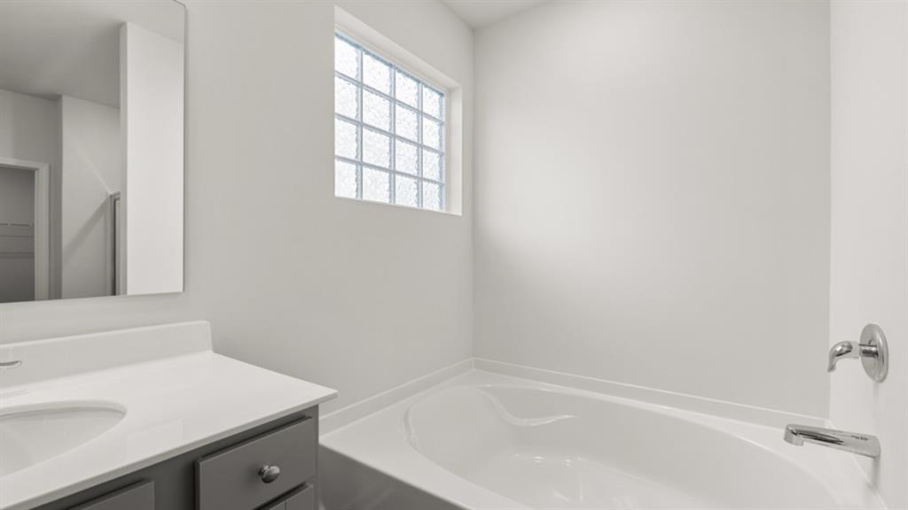 6012 Muirfield Point Union City, GA 30213 - Photo 23 of 37 a bath tub sitting next to a white sink