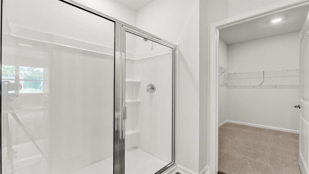 6012 Muirfield Point Union City, GA 30213 - Photo 24 of 37 a bathroom with a glass shower door