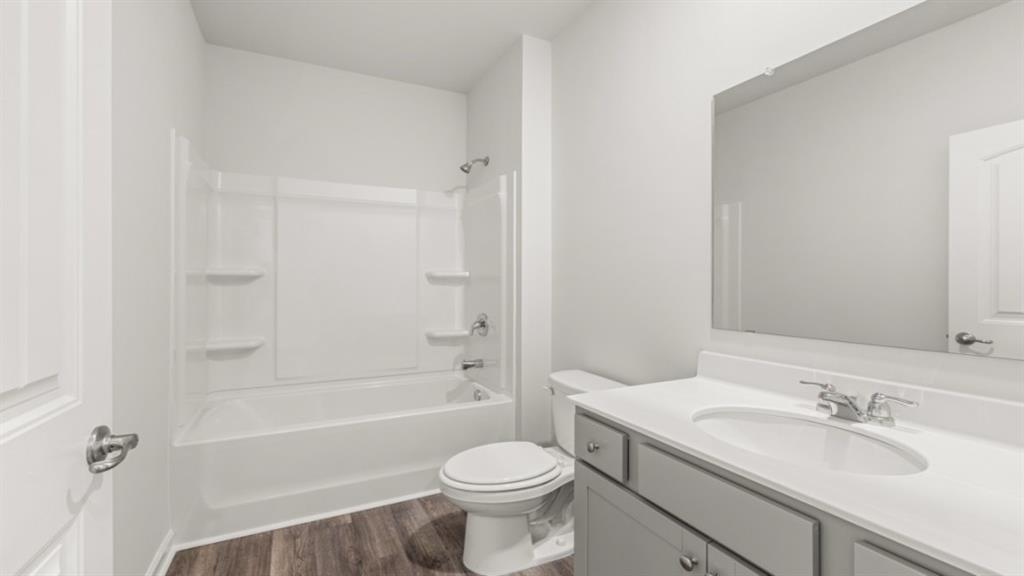6012 Muirfield Point Union City, GA 30213 - Photo 31 of 37 a bathroom with a sink toilet vanity and shower