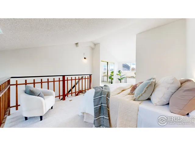 a living room with furniture and a lamp with wooden floor