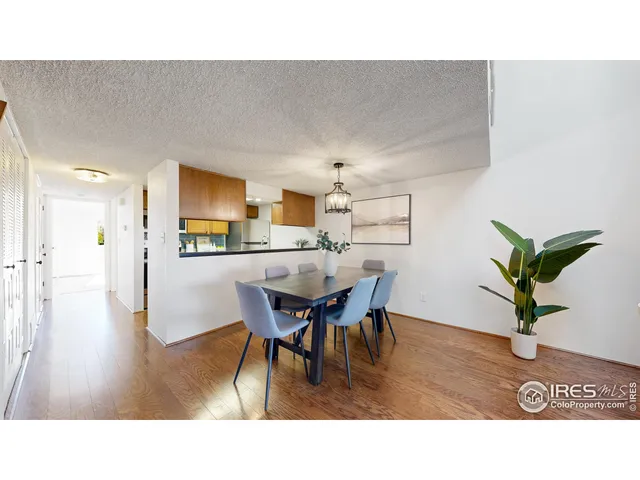 a kitchen with a table and chairs in it