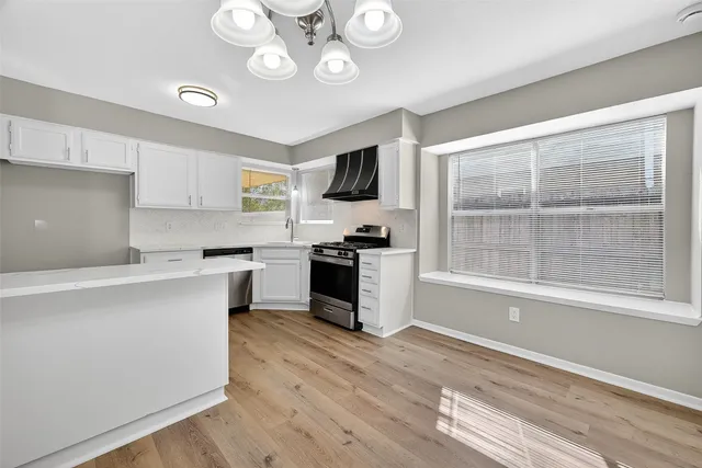a view of an empty room with a fan