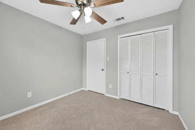 a kitchen with white cabinets stainless steel appliances and sink