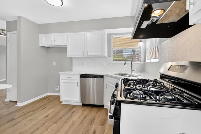a kitchen with a stove and a microwave
