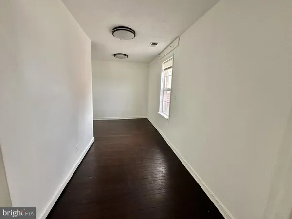 a view of a hallway with windows